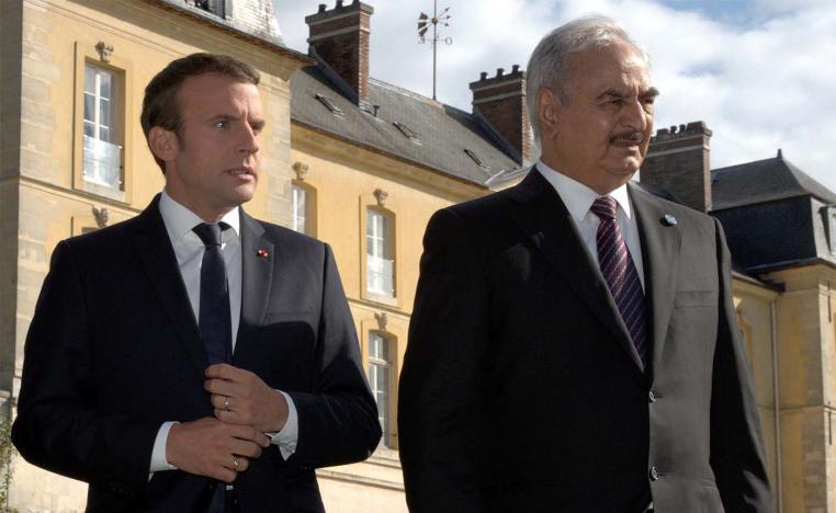 French President Emmanuel Macron with Khalifa Haftar (R)
