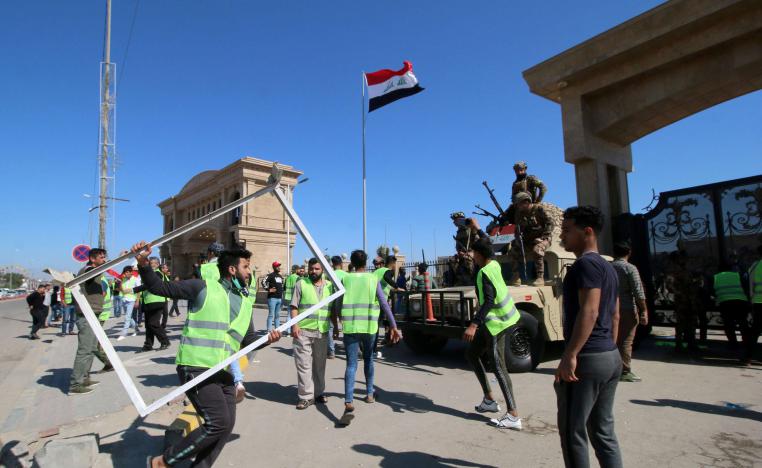 Iraqis protest near the provincial council building in Basra, last March