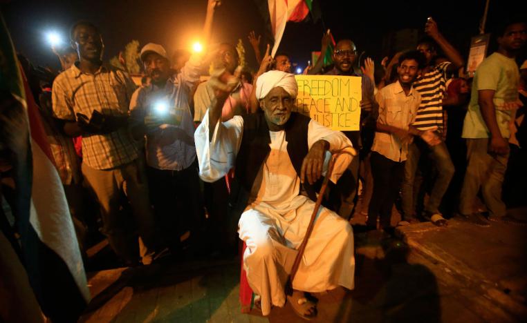 Sudanese protesters gather during a demonstration outside military headquarters in Khartoum