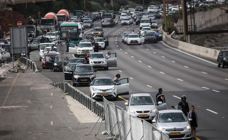 People in Tel Aviv stop and stand in silence for two minutes as sirens blared in memory of the 6 million Jews killed in the Holocaust