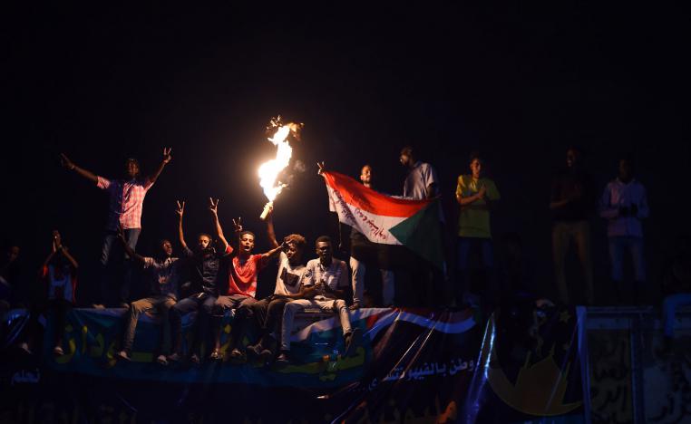Sudanese protesters gather for a sit-in outside the military headquarters in Khartoum