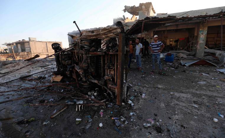 Syrians gather at the site of regime bombardment on the village of Kafr Halab