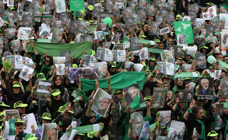 Supporters of Iranian presidential candidate Mir Hossein Mousavi wave green flags on June 9, 2009