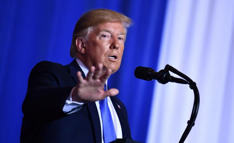 US President Donald Trump gestures during a press conference on the sidelines of the G20 Summit in Osaka
