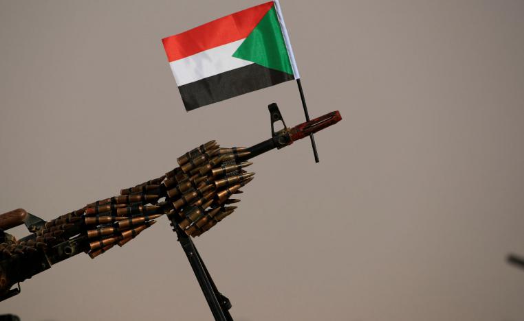 A Sudanese national flag is attached to a machine gun of Paramilitary Rapid Support Forces (RSF) soldiers
