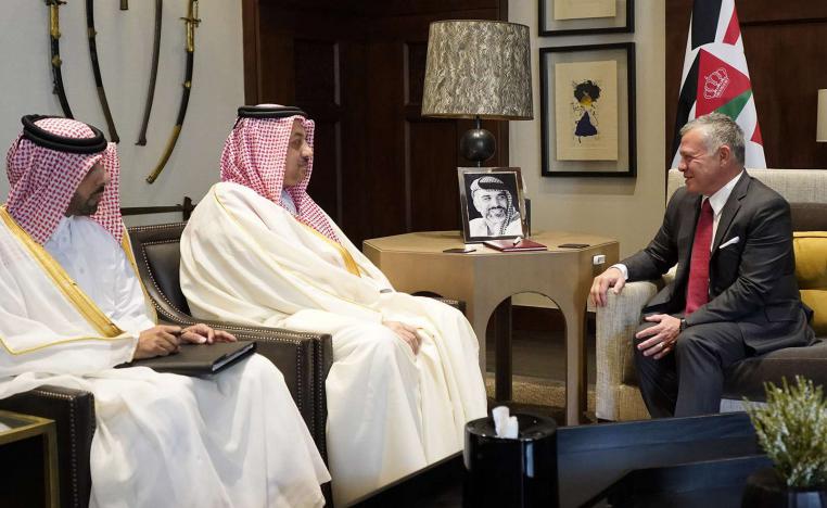 Jordanian King Abdullah II (R) receiving Qatar's Deputy Prime Minister of Qatar and Minister of State for Defence Affairs Khalid bin Mohammed Al-Attiyah (C) in the capital Amman