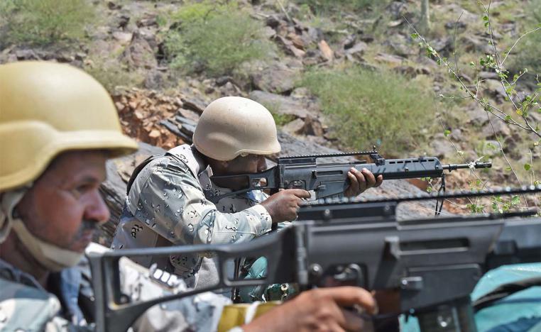 Saudi border guards keep watch along the border with Yemen in the al-Khubah area in the southern Jizan province