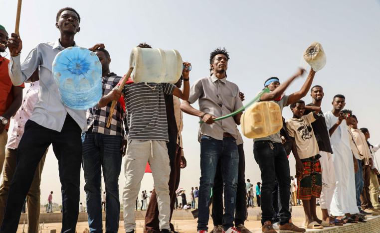 People take part in a protest condemning a deadly crackdown last month in Khartoum