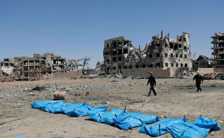 Photo taken on April 23, 2018 shows bodies that have been found in a mass grave in the former Islamic State group stronghold of Raqa in Syria