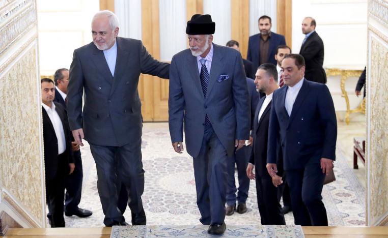 Iranian Foreign Minister Mohammad Javad Zarif, left, welcomes his Omani counterpart Yousuf bin Alawi