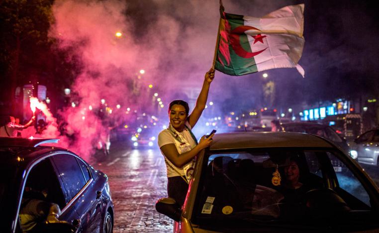 Algeria supporters celebrate on the Champs-Elysees in Paris