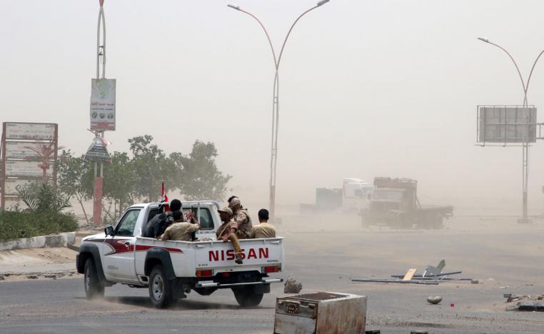 Members of UAE-backed southern Yemeni forces patrol a road during clashes with government forces in Aden, Yemen