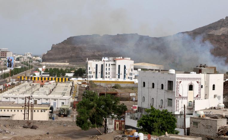 Smoke rises during fighting in Aden