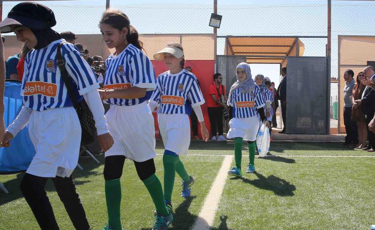 Children at Zaatari Refugee Camp wear jerseys of their favourite Spanish teams to celebrate being part of La Liga Zaatari Social Project