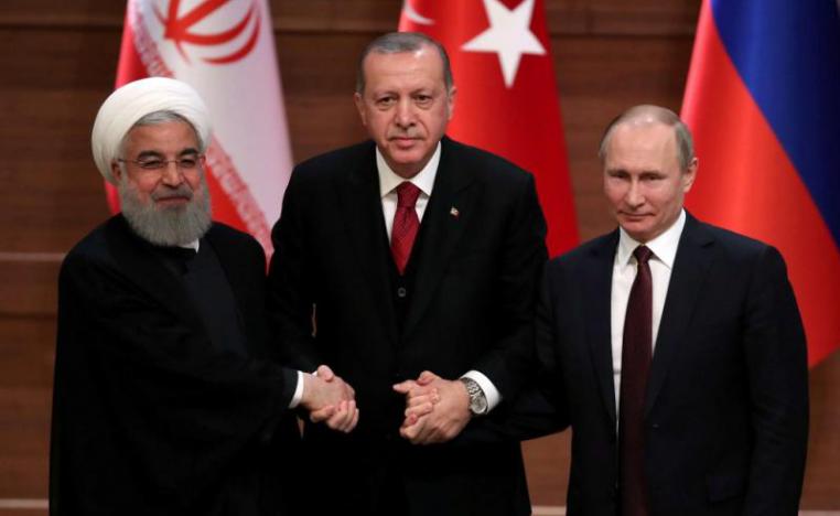 Iranian President Hassan Rohani (L), Turkish President Recep Tayyip Erdogan and Russian President Vladimir Putin