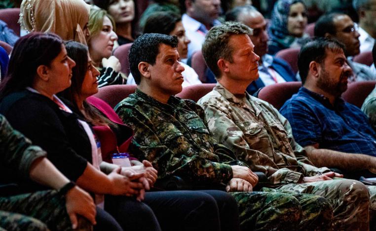 Mazloum Kobani (3rd-L), commander-in-chief of the Syrian Democratic Forces (SDF), and Brigadier-General Nicholas Pond (2nd-R), a representative of the US-led coalition