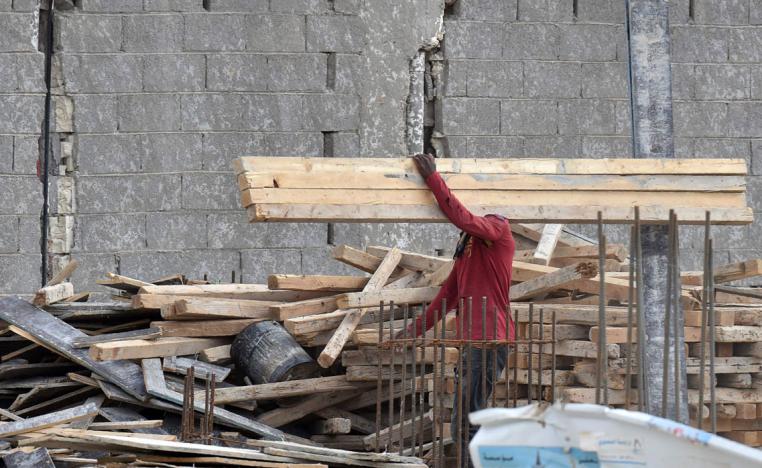 A foreign labourer works on the construction of a house in the Saudi capital Riyadh