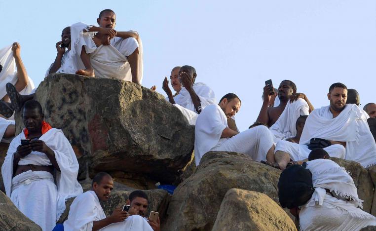 At the peak of Mount Arafat, numerous Muslim pilgrims were absorbed in Koranic verses displayed on their smartphones
