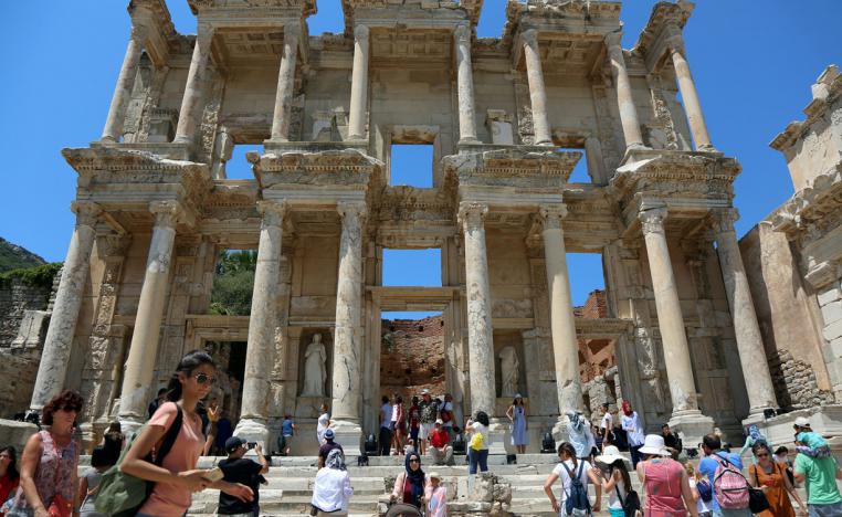 Tourists visit the Celsius Library in the ancient city of Ephesus near Izmir, Turkey
