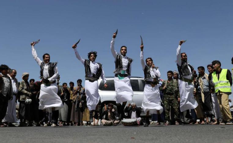 Huthi supporters perform the traditional Baraa dance during a ceremony held to collect supplies for Huthi fighters in Sanaa