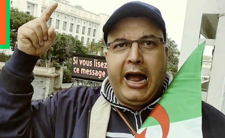 Opposition activist Fodil Boumila attends a protest in Algiers