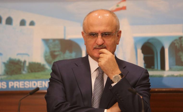 Finance Minister Ali Hassan Khalil gestures during a news conference at the presidential palace in Baabda