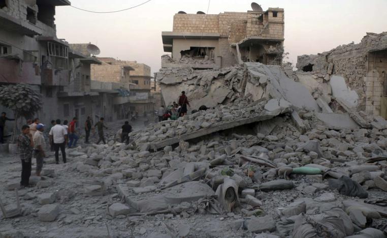 Syrian people searching for victims under the rubble of destroyed buildings