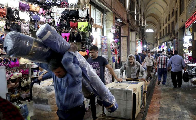 People conduct their business at the old main bazaar in Tehran, Iran