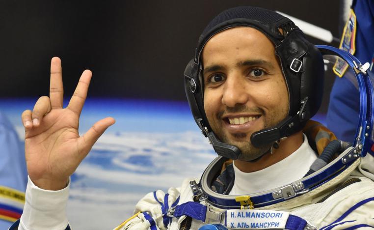United Arab Emirates' astronaut Hazza Al Mansouri waves before boarding a Soyuz rocket to the International Space Station (ISS) at the Russian-leased Baikonur cosmodrome in Kazakhstan