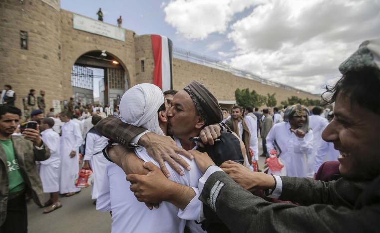 A Yemeni detainee is greeted by his relative and friends after his release from a prison controlled by Huthi rebels, in Sanaa