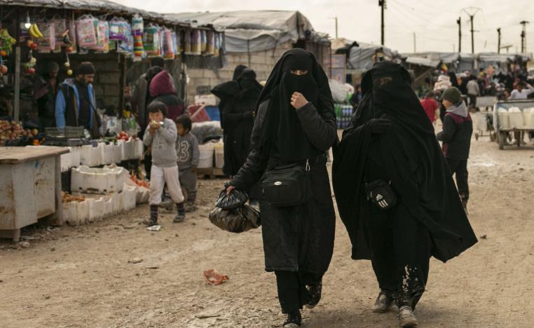 Women shop in the marketplace at al-Hol camp, home to families of Islamic State fighters, in Hasakeh province, Syria