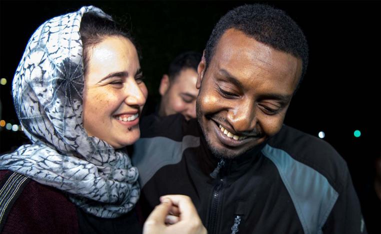 Moroccan journalist Hajar Raissouni (L) is greeted by her boyfriend Rifaat Al Amine upon leaving a prison in Sale