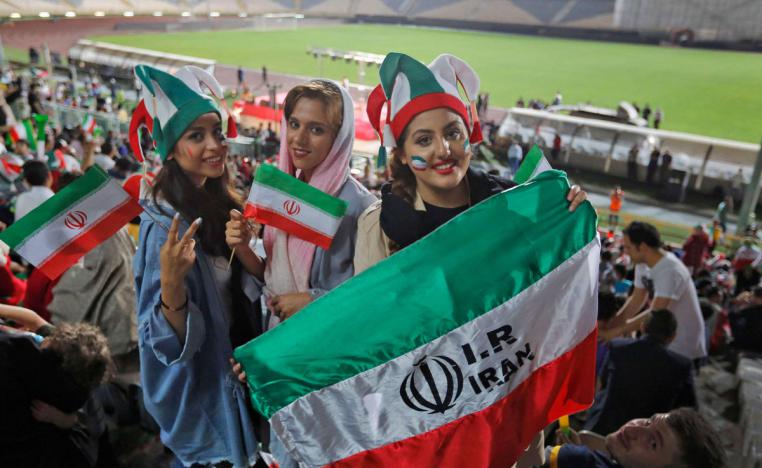 Iranian women watch the World Cup Group B soccer match between Portugal and Iran at Azadi stadium in Tehran