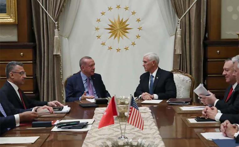 Turkish President Recep Tayyip Erdogan (L) speaks with US Vice President Mike Pence (R), during their meeting at the Presidential Palace in Ankara