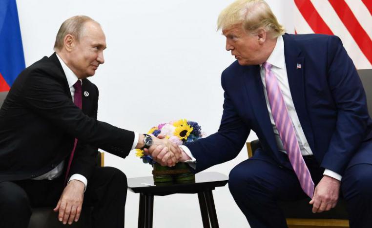 Photo taken on June 28, 2019 shows US President Donald Trump (R) attends a meeting with Russia's President Vladimir Putin during the G20 summit in Osaka.