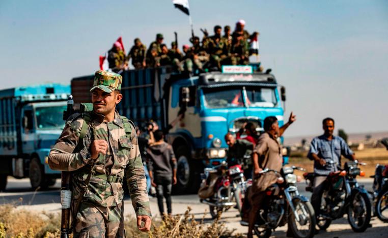 Syrian government forces arrive in the town of Tal Tamr