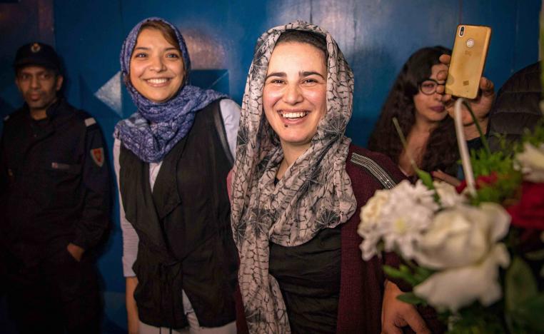 Moroccan journalist Hajar Raissouni (R) is greeted after leaving a prison in Sale near Rabat