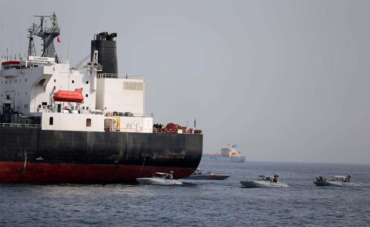 UAE Navy boats next to Al Marzoqah Saudi Arabia tanker attacked off the Port of Fujairah