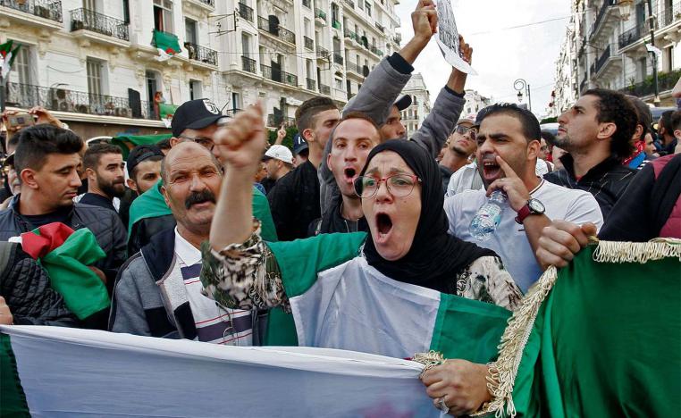 Algerian protesters chant slogans during the 37th consecutive Friday anti-government protests in Algiers