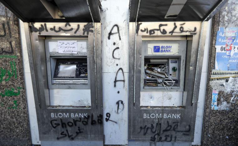 A vandalised ATM machine is pictured at the al-Nour Square in the northern port city of Tripoli