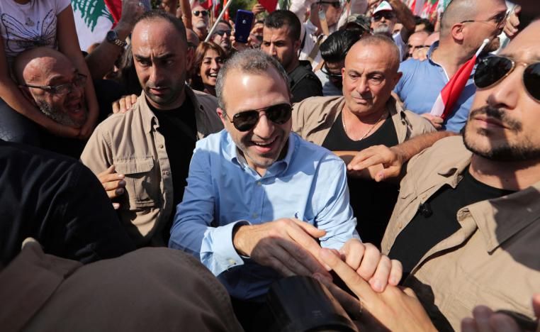 Lebanese Foreign Minister Gebran Bassil greets supporters during a protest near the presidential palace in Beirut