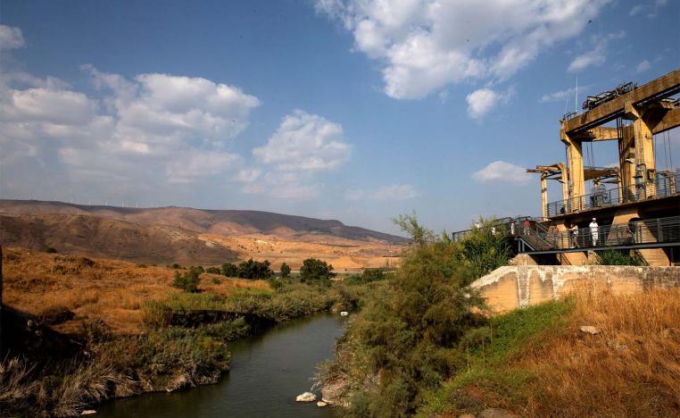 A general view show visitors at an abandoned hydroelectric power plant in the border area between Israel and Jordan near Naharayim 