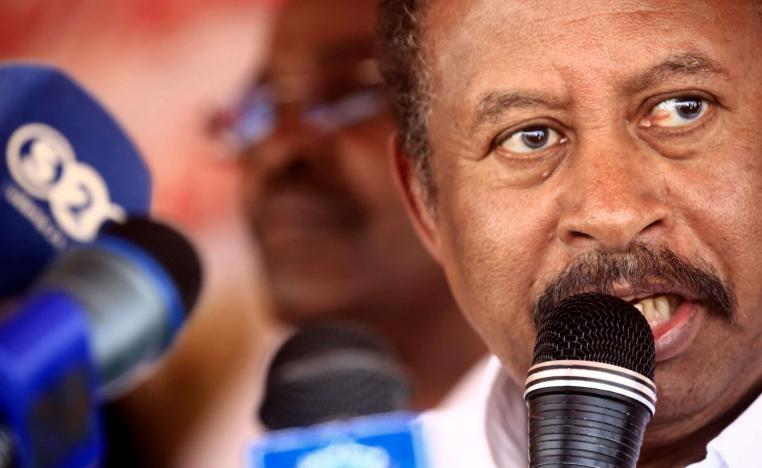 Sudan's prime minister Abdalla Hamdok speaks during a visit to a camp for internally displaced people (IDP) in El-Fasher, the capital of the North Darfur state