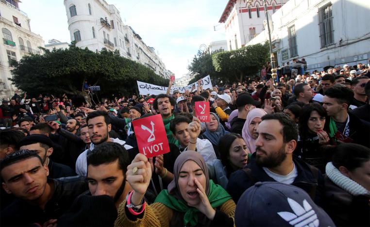 Demonstrators shout slogans during a protest calling to reject the upcoming presidential election in Algiers