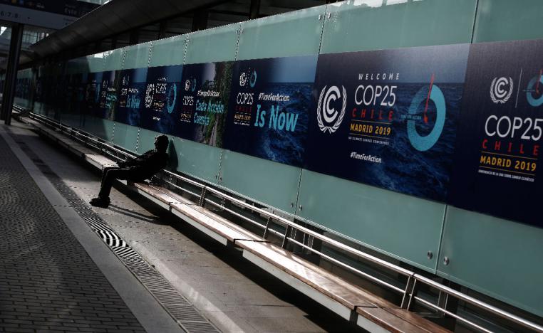 A man sits at the COP25 climate talks congress in Madrid