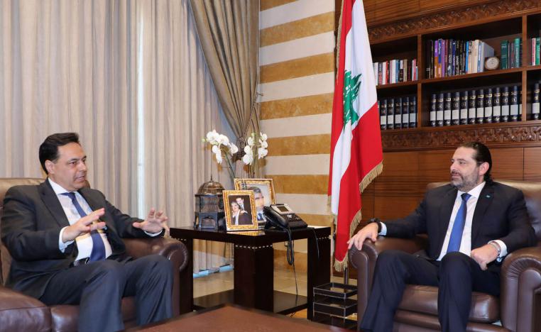 رئيس الوزراء اللبناني المستقيل سعد الحريري يستقبل رئيس الوزراء المكلف حسان دياب