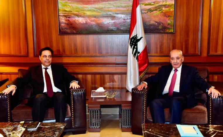 Parliament Speaker Nabih Berri, right, meets with newly-assigned Lebanese Prime Minister, Hassan Diab