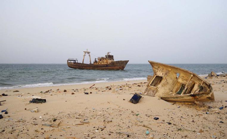 A decaying boat is seen docked off the port of Nouadhibou 