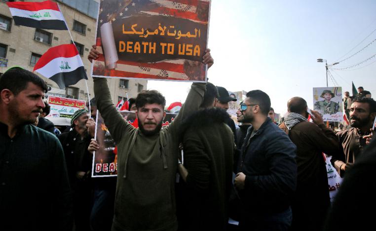 Iraqi supporters of the Hashed Al-shaabi armed network, demonstrate in the capital Baghdad's Tahrir Square