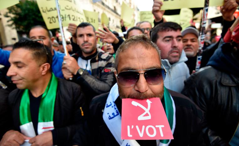 Algerians chant slogans as they march during an anti-government demonstration in the Algerian capital Algiers